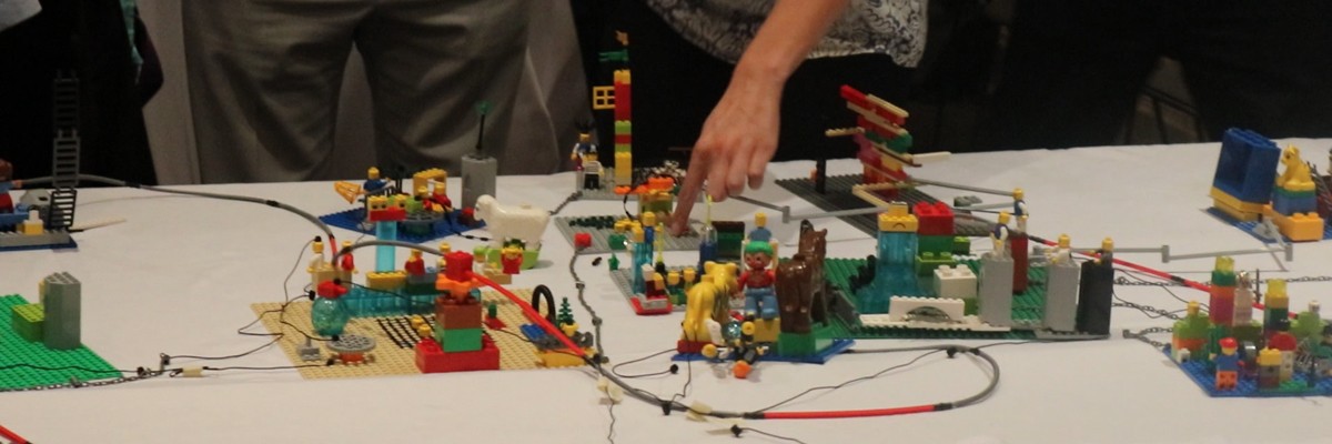 A woman points to a display table